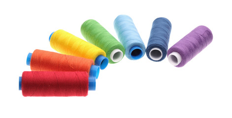 Coils from a thread of different colors on a white background