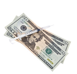 syringe and money