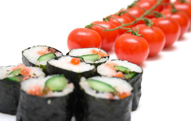 Japanese sushi and ripe red tomatoes