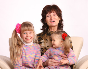 Happy grandmother and two granddaughter.