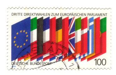 Fototapeta na wymiar Old canceled german stamp with flags