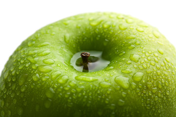 fresh green apple with water droplets isolated