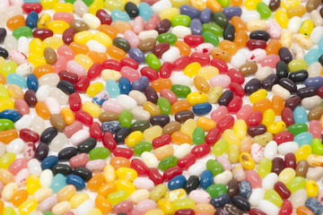 Red jellybean heart with arrow surrounded by other jellybeans