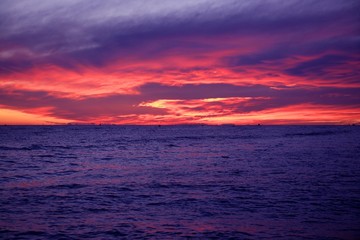 Naklejka na ściany i meble Red and blue sunrise in Mediterranean sea
