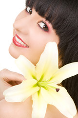 Young woman with lily flower