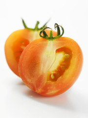 slices of tomato ron the white back ground