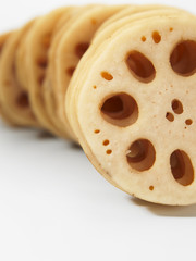 slices of lotus root on the white back ground