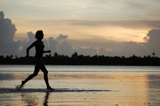 Young Woman Runner, Jogging In Water, Bora French Polynesia