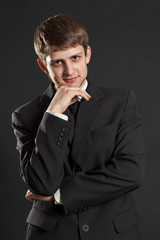 smiley businessman in black suit