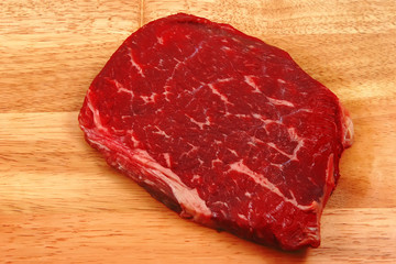 raw steak on cutting board