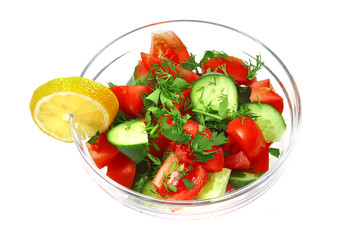 fresh raw vegetable salad in transparent bowl