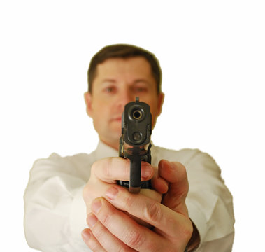 The man holds handgun