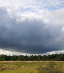 Fototapeta na wymiar Field and storm clouds photo