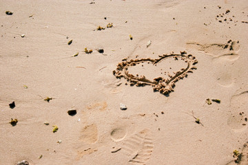 heart scratched into the sand