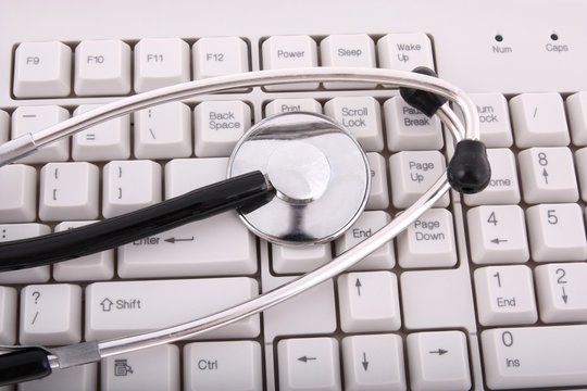 A stethoscope on a computer keyboard