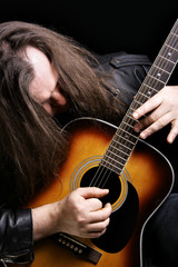 Man playing acoustic guitar