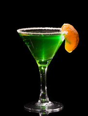 Back lit martini glass with absinthe cocktail