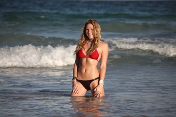 Woman posing in the ocean