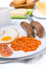 egg, sausages, beans, bacon with coffee, buns and cheese