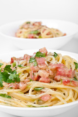 Two servings of traditional spaghetti carbonara