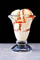 French vanilla ice cream with fruit sauce