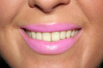 Obraz premium Close up of smiling womans mouth and teeth