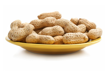 ripe dry nuts on a dish isolated