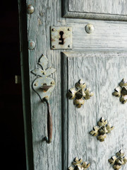 Old church door with latch and keyhole
