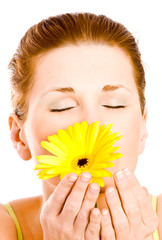 Beautiful young woman with gerber flower
