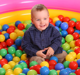 Fototapeta na wymiar Birthday of fun boy in balls.