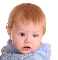 Portrait of baby boy in blue dress.