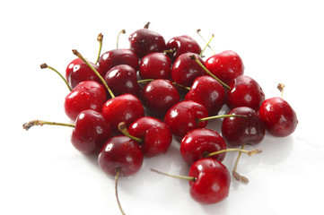 Obraz na płótnie Canvas cherry red wet fruits macro on white