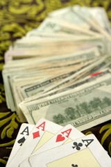 dollar notes and poker cards, gambler tools