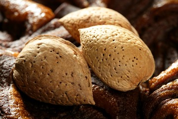 Almond nuts over chocolate, delicious golden food