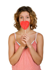 Girl with red heart shaped candy