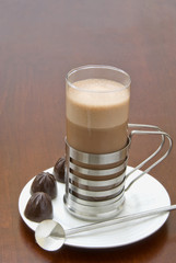 Hot chocolate in a contemporary stainless steel glass