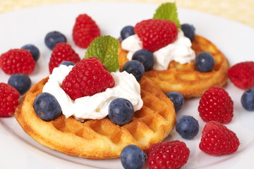 Belgian waffles with berries and cream
