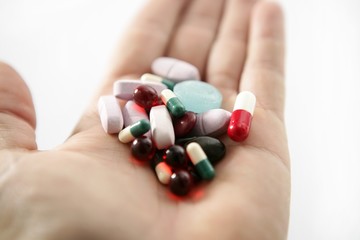 pills over white, health or suicide
