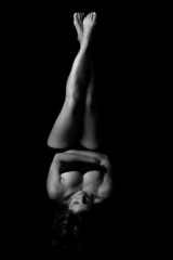 sexy woman with legs and feet up - low-key picture in b&w