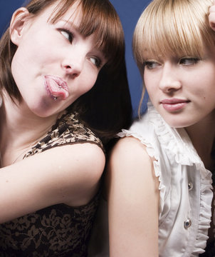 girl put out  tongue pirsing to her friend