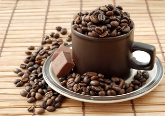 Cup with coffe beans