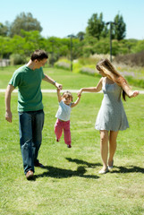 Fototapeta premium Happy family on walk in park