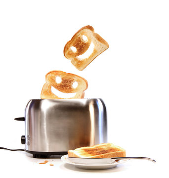 Toasted bread with toaster on white