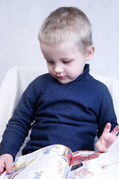 Little Boy Reading a book