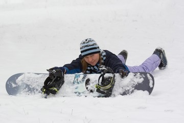 Fototapeta na wymiar Girl holding her snowboard.