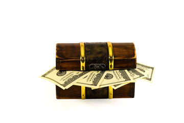 old chest with dollars isolated on white
