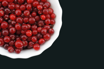 Fresh cranberry on a plate.
