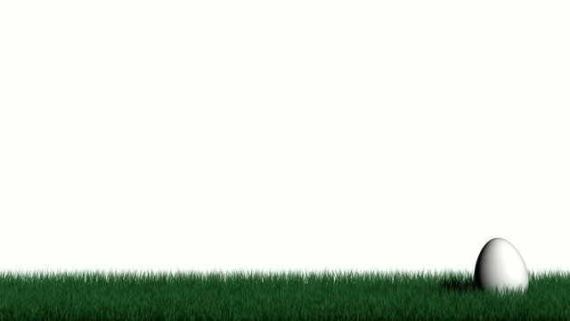 Osterei rollt im Gras