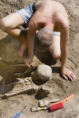 Archaeologist excavating prehistoric grave
