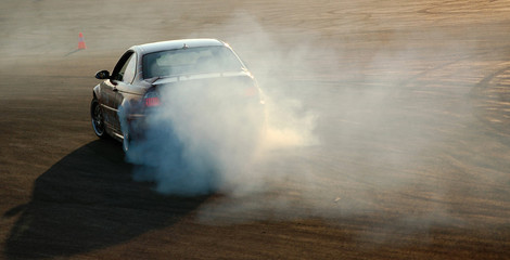 Car drifting with smoke trail